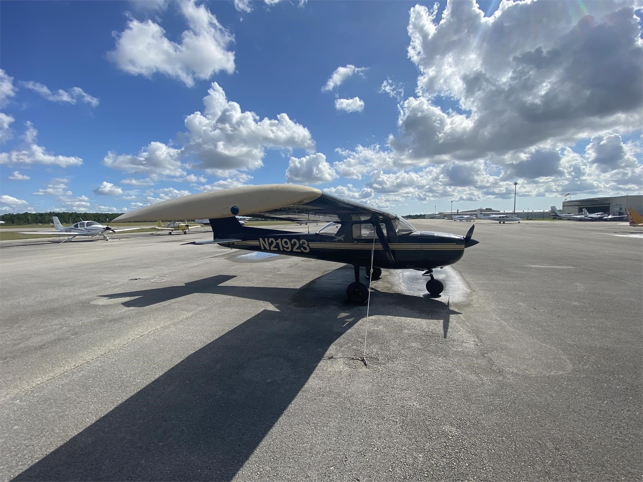 N21923, a black Cessna 152 operated by GPS Flight School was smoking in the air, with the